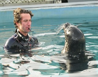 Photo of Kane Cunningham with a sea lion