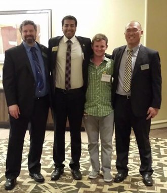 Admissions Director Michael McCawley and SUA Chair Shaz Umer with two UCSC alumni.