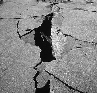 Photo of crack in the ground caused by the Loma Prieta earthquake.