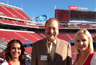 Chancellor Blumenthal with 49ers cheerleaders.