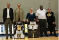 Chancellor Blumenthal and EVC Alison Galloway receive personalized Slug basketball jerseys from, left to right, Alumni Council member Stephen Abreu (Kresge '00), Coach Gordy Johnson, and Athletic Director Linda Spradley. Photo by Alison Garcia. 